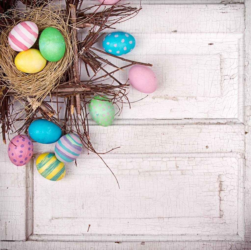 Easter eggs in nest on antique panel