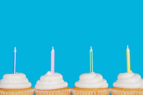 Vanilla cupcakes with candles — Stock Photo, Image