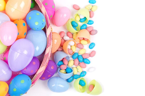 Plastic easter eggs and candy — Stock Photo, Image