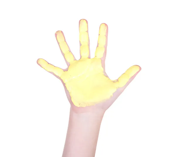 Childs hand with yellow paint on it — Stock Photo, Image