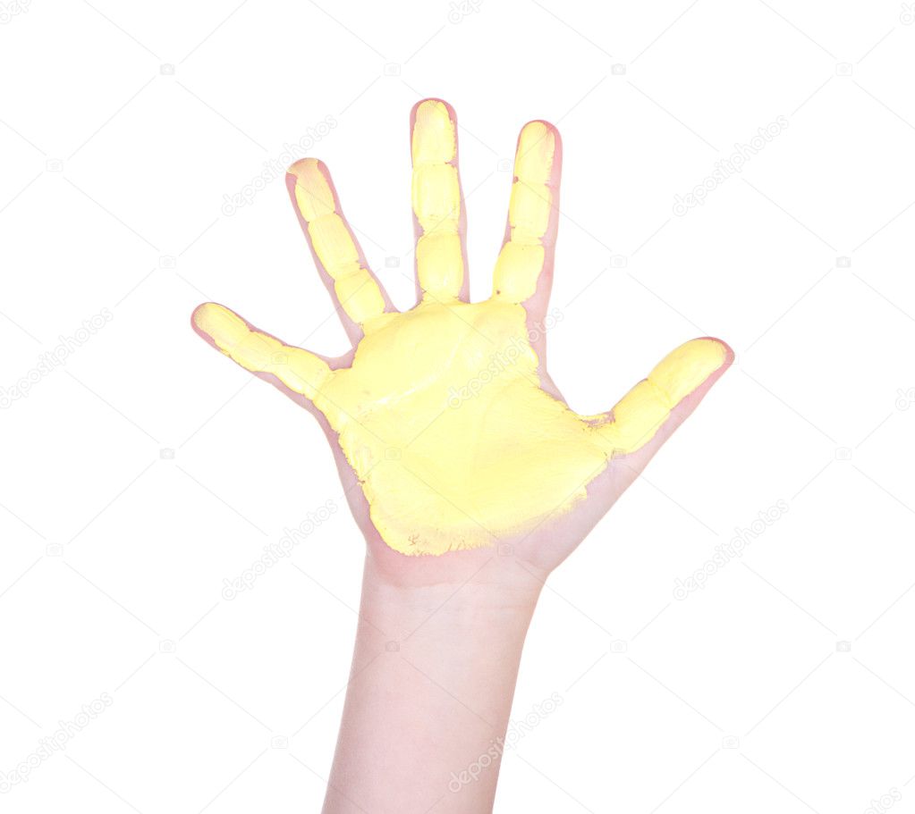childs hand with yellow paint on it