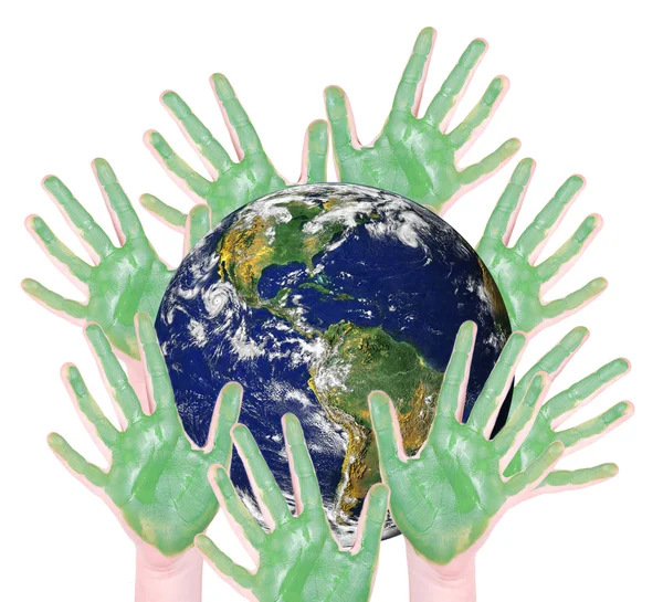 Green hands around a globe: parts of this image furnished by NAS — Stock Photo, Image