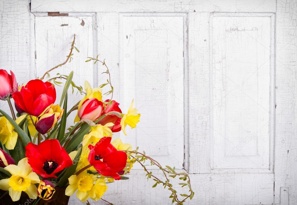 Spring flowers with a wooden background