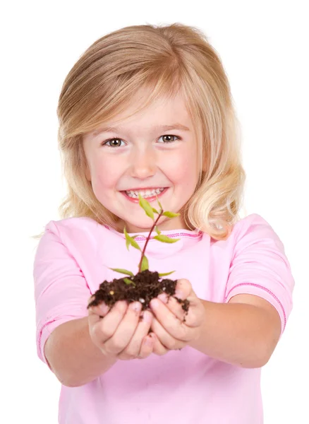 Criança segurando uma planta — Fotografia de Stock