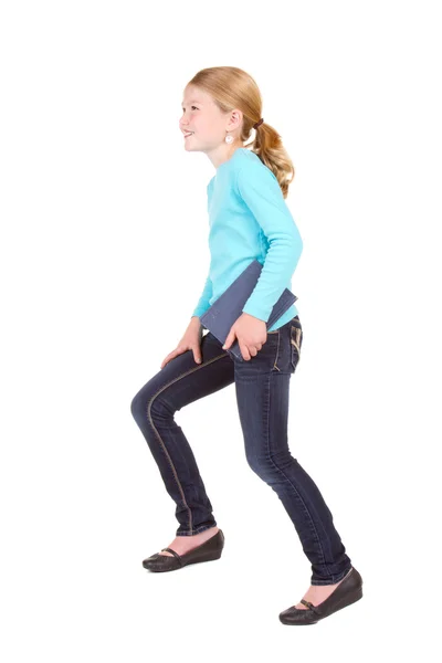 Child holding book stepping — Stock Photo, Image