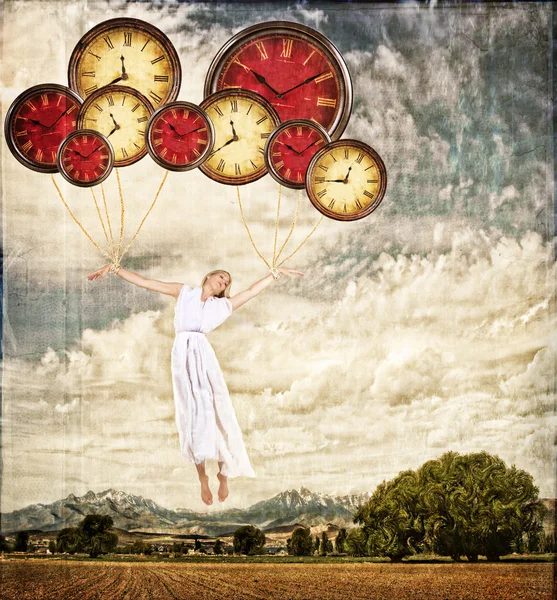 Woman tied to clocks floating away — Stock Photo, Image