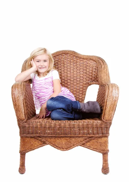 Little girl sitting on a chair — Stock Photo, Image