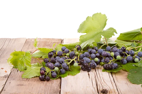 Grapes on wooden plank — Stock Photo, Image