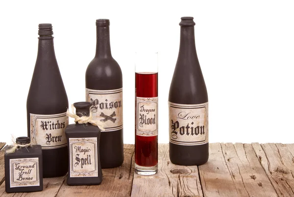 Potion bottles on wooden crates — Stock Photo, Image