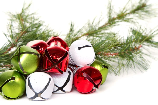 Christmas jingle bells and pine branch — Stock Photo, Image