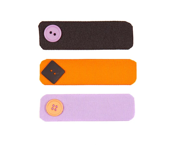 Halloween colored ribbon tags with buttons — Stock Photo, Image