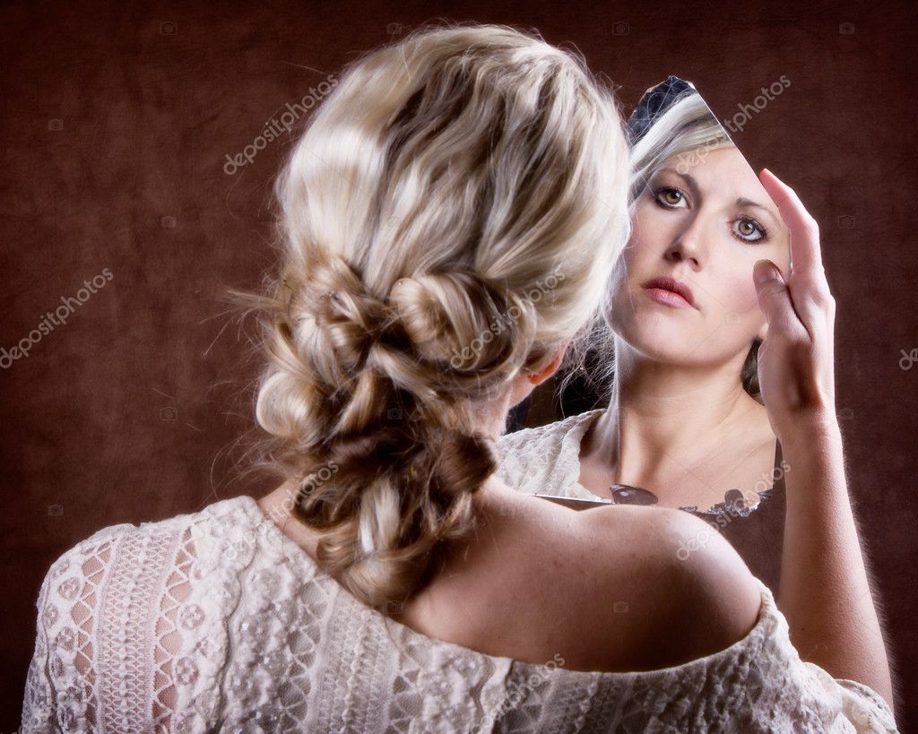 Woman Looking Into A Broken Mirror Stock Photo Sjhuls 39253619 Woman Looking Into A Broken Mirror With Sad Look Back Of Head Showing Photo By Sjhuls