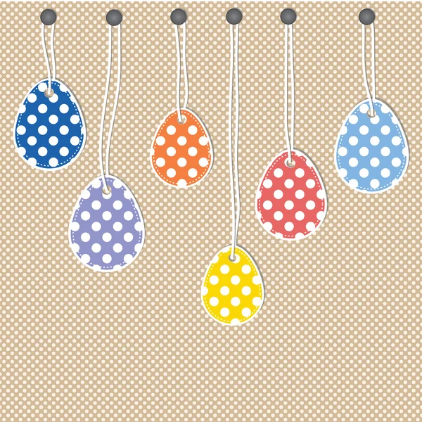 Easter eggs hanging from strings — Stock Vector