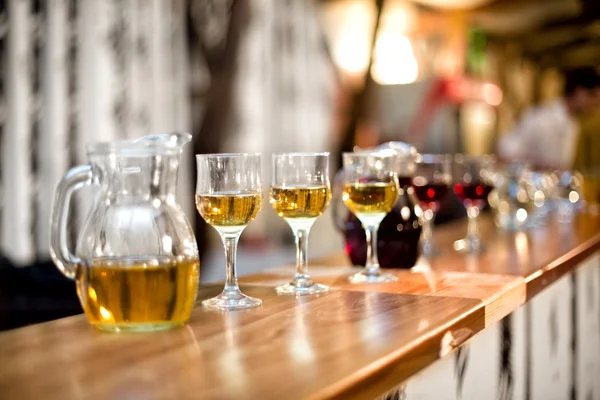 Wine glasses with carafe and champagne at dinner cocktail party — Stock Photo, Image