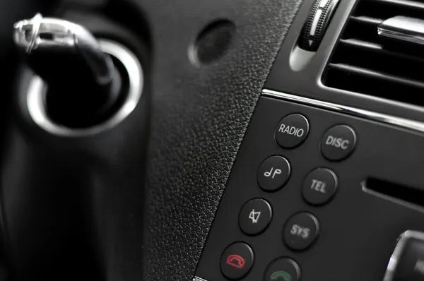 Modern car cockpit with controls and ignition key — Stock Photo, Image