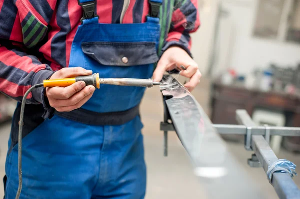 Auto mechanic engineer welding plastic with special professional tools plastic welder — Stock Photo, Image