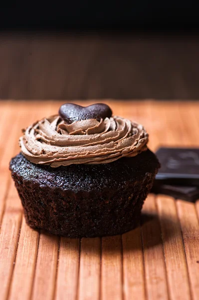 One chocolate muffin stuffed with sweet creamy hazelnut sauce — Stock Photo, Image