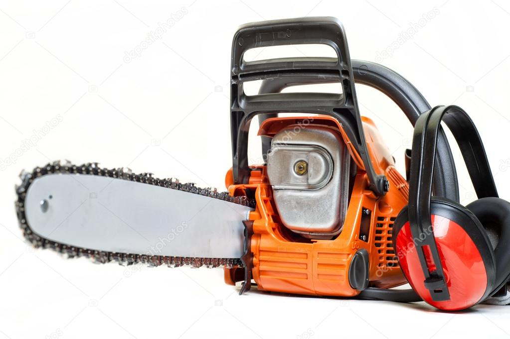 Mechanical gasoline powered chainsaw with protective gear and acessories, isolated on white background
