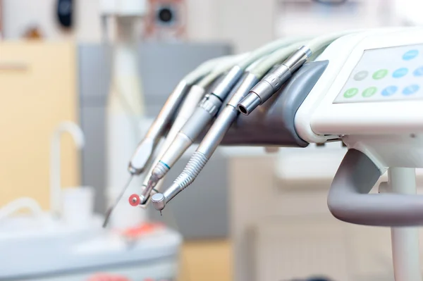 Dental tools on dentist chair with medical equipment and new technology — Stock Photo, Image