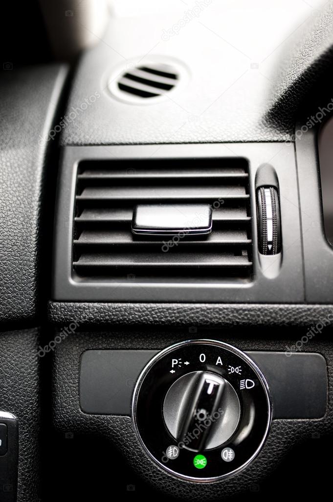 Car ventilation system and headlight adjustment on dashboard of modern car