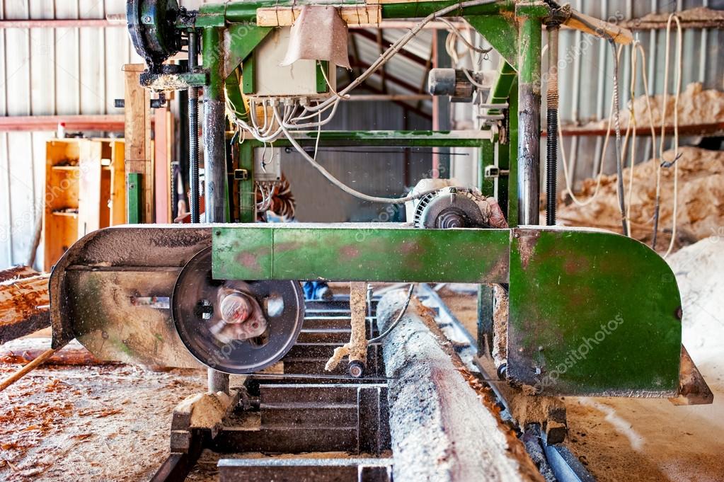 Indusstrial wood production factory bandsaw sawmill being use to