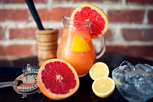 Grapefruit fresh lemonade drink in summer jug — Stock Photo, Image