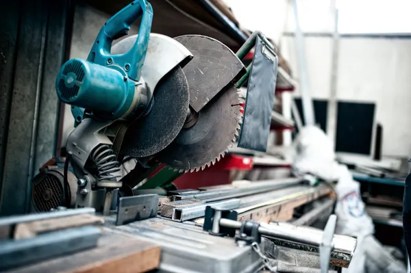 Industrial metal cutting tool in factory, sliding compound mitre saw with sharp blade. steel and metal manufacturing — Stock Photo, Image