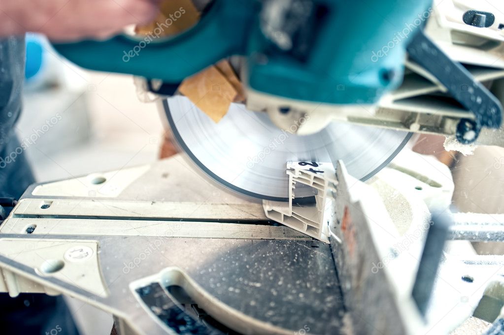Worker Or Handyman Cutting Pvc Profile With Circular Saw Sliding Compound Mitre Saw Pvc Windows And Doors Production Factory Stock Photo By C Bogdan Hoda 50806561