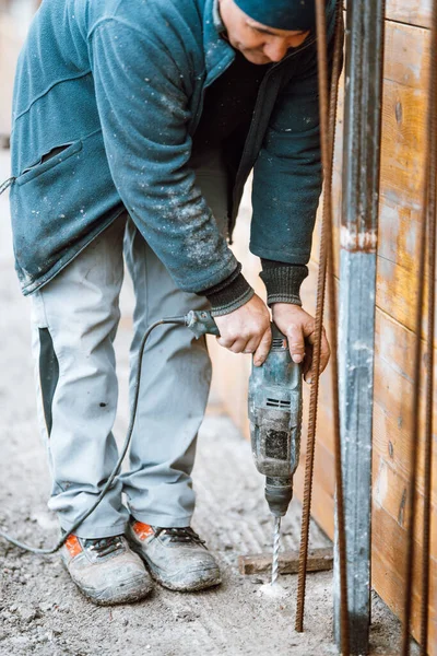 Details of machinery masonry rotary drill on construction site, concrete details