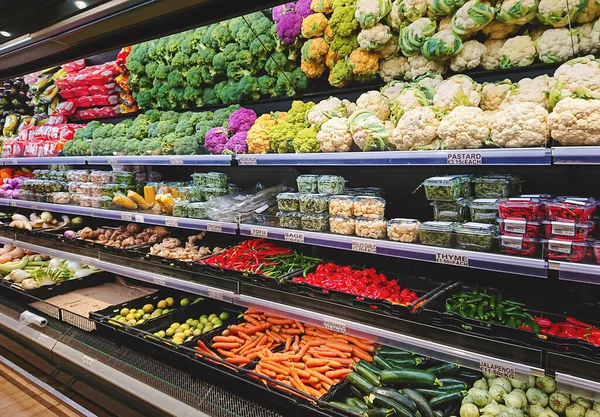 Fresh vegetable counter in supermarket. Fruits and vegetables on shop stand in supermarket grocery store