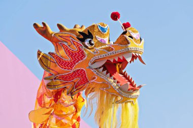 Head Chinese Dragonagainst blue sky during celebration of Chinese New Year