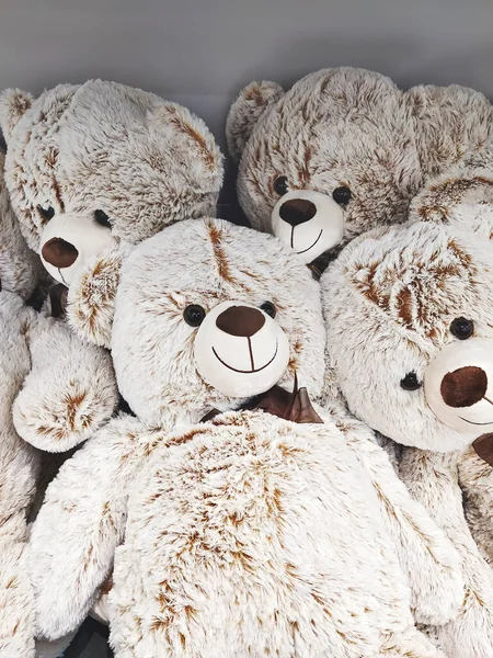 Fuzzy and fluffy cozy soft toy bears close up, full-frame background