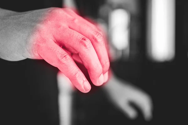 Fingers pain in office syndrome concept. Pain symptom area is shown with red color. Medium close up shot in black and white tone.