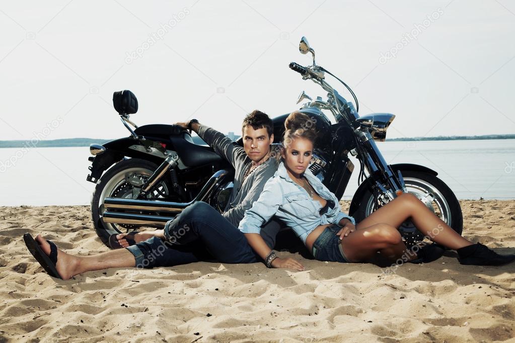 Couple resting on beach - travel destination