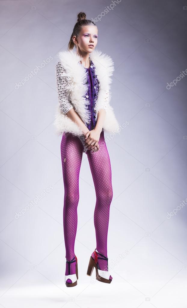Modern lifestyle - fashion woman model posing in pink stockings