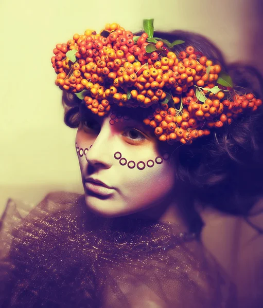 Fairy tale. Floristics. Woman in wreath of rowan berry - grunge — Stock Photo, Image