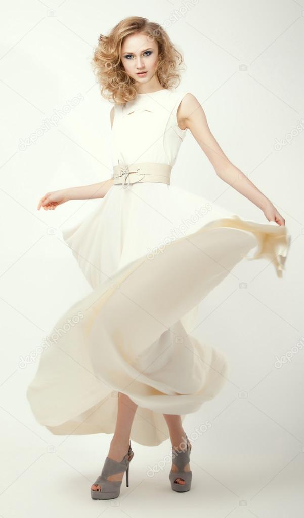 Femininity. Fashion Model in Long Light Dress. Smart Casual Clothes. Summertime Collection