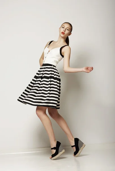 Fashion Style. Happy Young Shopper in Contrast Striped Grey Skirt. Movement — Stock Photo, Image