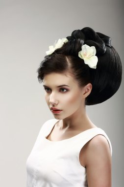Face of Beautiful Brunette Bride Fashion Model. Elegant Hairdo with Vernal Flowers clipart