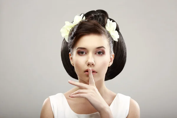 Hush! Beautiful Young Woman showing Silence Sign with her Forefinger. Warning — Stock Photo, Image
