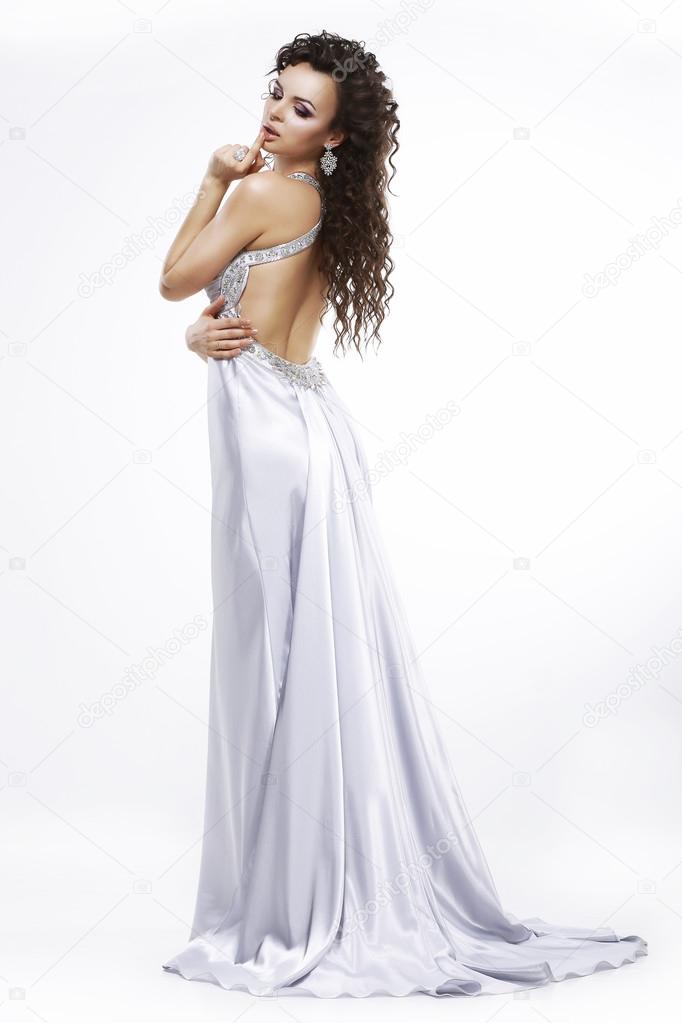 Luxury. Elegance. Glamorous Woman in Light Shiny Dress. Dolce Vita