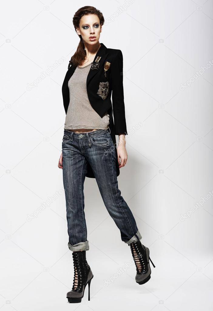 Fashionable Glamorous Woman in Jeans and High Boots. Vogue Style