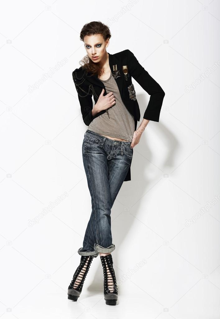 Vogue. Full Length Portrait of Stylish Woman in Informal Pose