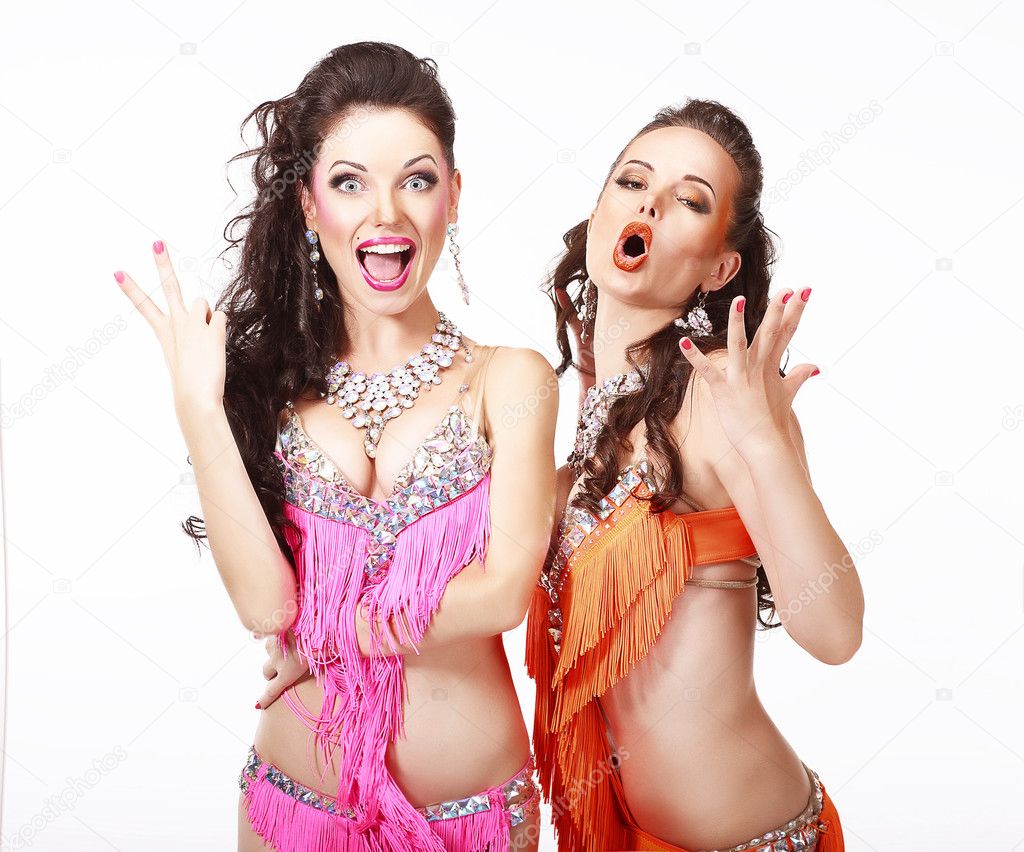 Belly Dance. Two Women in Oriental Stage Costumes Singing