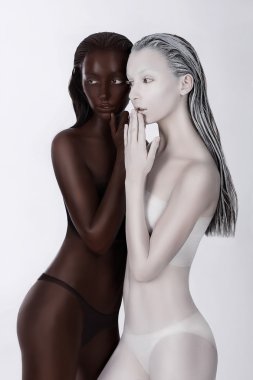 Ethnicity. Fantasy. Futuristic Women Painted White and Black. Art Bodypainting clipart