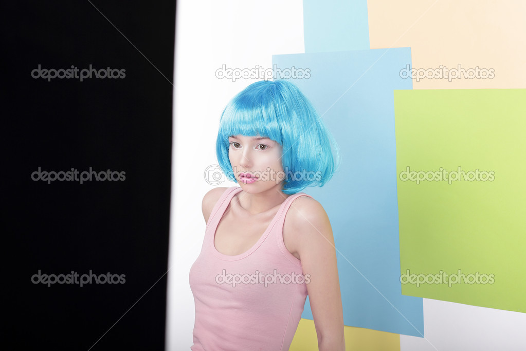 Portrait of Pensive Beautiful Girl in Fancy Blue Wig and Pink Singlet