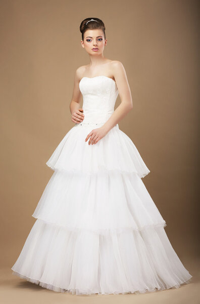 Caucasian Woman in White Long Dress Posing in Studio