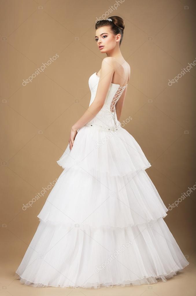 Full Length Portrait of Graceful Bide in White Wedding Dress