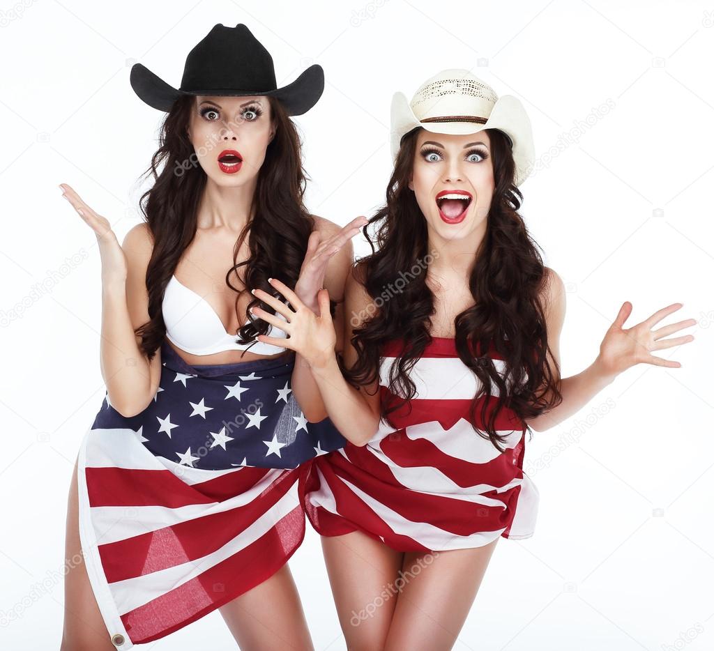 Two Funny Happy Women in Hats Wrapped in USA Flag
