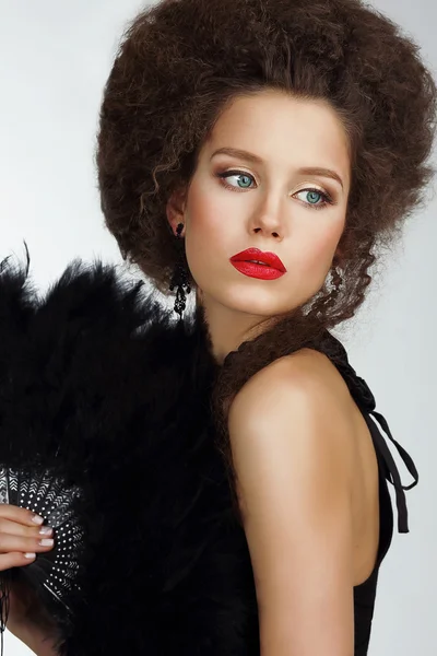 Character. Refined Exquisite Brunette holding Fan with Feather — Stock Photo, Image